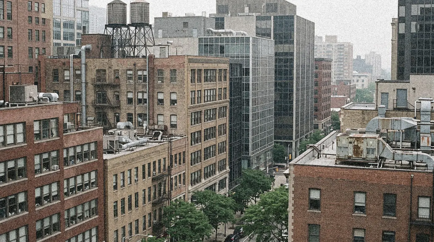 Mid-rise office buildings downtown, seen from across the street in daytime